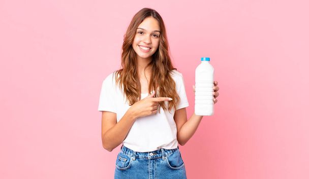young pretty woman with a bottle of milk and glass - Foto, Imagem