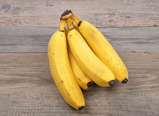 Plátanos sobre madera
 - Foto, imagen