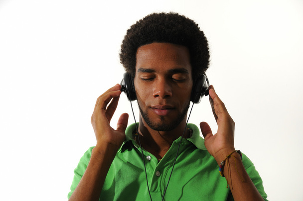 African man enjoying music with headphones - Foto, afbeelding