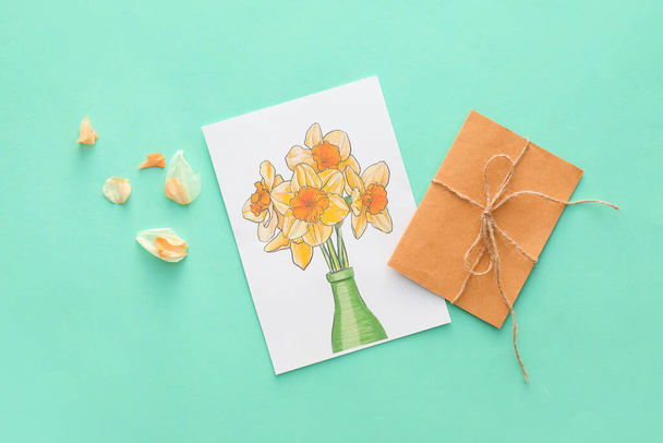 Beautiful greeting card and envelope on color background - Foto, Imagen
