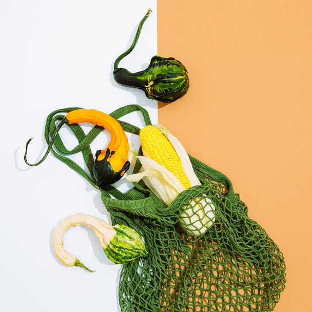 Zero waste stylish scene.  Eco bags, organic pumpkin and corn. Eco friendly and reuse concept. Top view - Photo, image