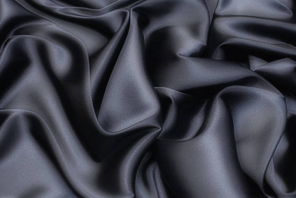 Tissu en soie, cadi, couleur noire dans la mise en page artistique - Photo, image