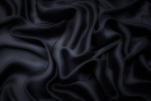 Silk satin fabric. Black colour. Texture, background, pattern. - Photo, Image