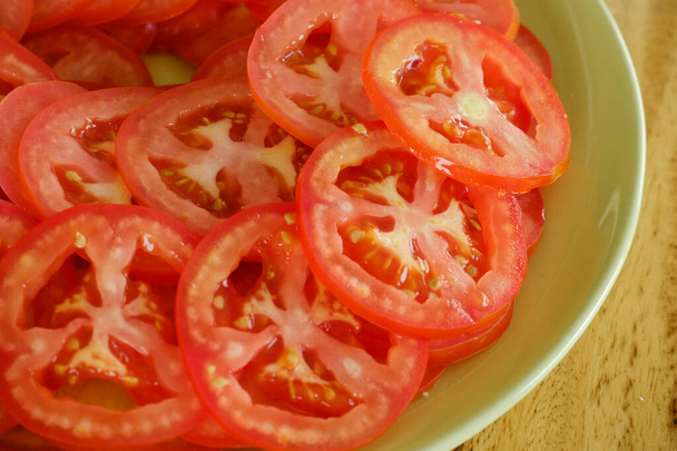 Sliced fresh tomatoes in a plate. - Photo, Image