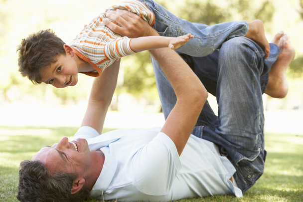 Father And Son Playing Together In Park - Photo, Image