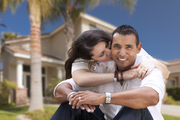 Happy Hispanic Young Couple in Front of Their New Home - Photo, Image