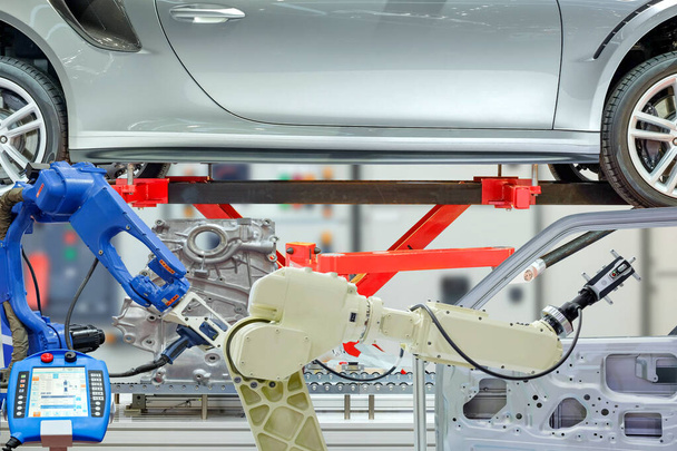 Appareil de balayage 3D installé robotisé industriel pour numériser les pièces automobiles pour mesurer les données avec télécommande pour programmer l'automatisation du travail sur fond de panneau de commande flou, concept de l'industrie 4.0 - Photo, image