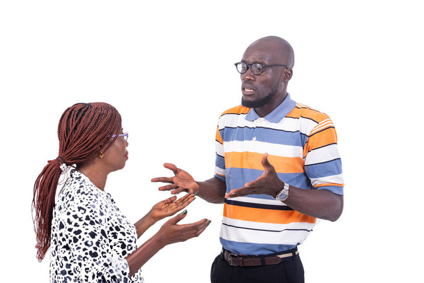 a couple in glasses standing on a white background arguing. - Foto, imagen