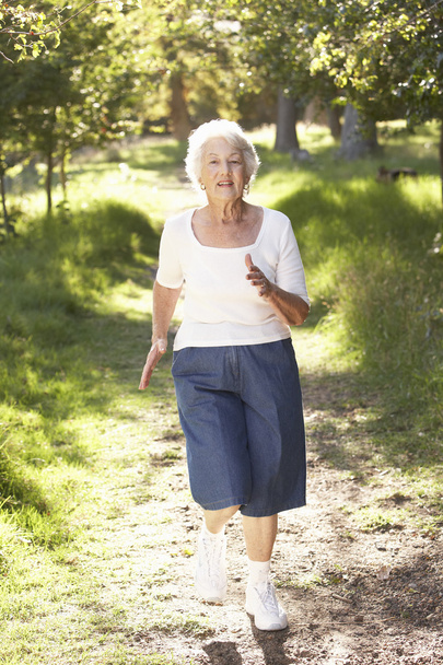 Senior Woman Jogging In Park - Zdjęcie, obraz