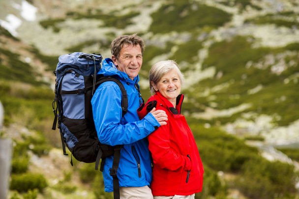 Senior couple hiking at mountains - Photo, Image