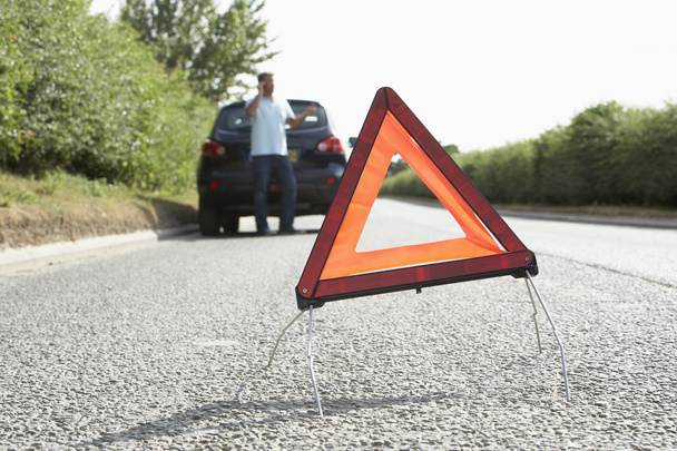 Driver Broken Down On Country Road With Hazard Warning Sign In F - Φωτογραφία, εικόνα
