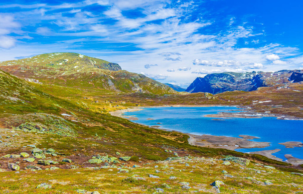 Amazing Vavatn lake panorama rough landscape view rocks boulders and mountains during summer in Hemsedal Norway. - Fotoğraf, Görsel