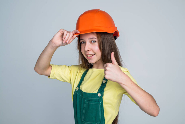 thumb up. female builder in hard hat. building and construction. child architect worker. - Φωτογραφία, εικόνα