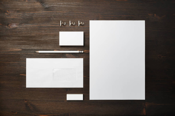 Photo of blank stationery set on wood table background. Corporate identity mock up for placing your design. Top view. Flat lay. - Photo, image
