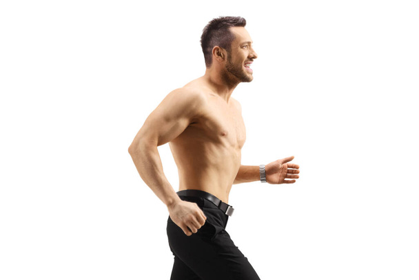 Fit shirtless man running isolated on white background - Foto, immagini