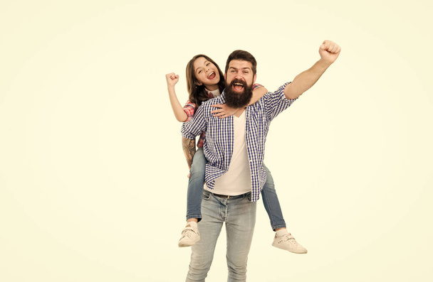 Play to win. Happy winners in photo studio. Bearded man and little child make winners gesture. Emotional family shout and celebrate. Victory celebration. Winners never give up - Foto, Bild