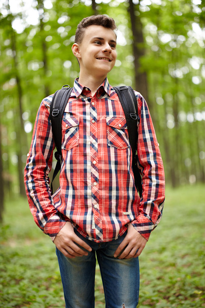 Teenager boy with school bag - Фото, изображение