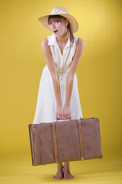 Surprised woman with old suitcase - Foto, Bild