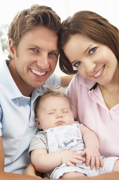 Close Up Of Parents Cuddling Newborn Baby Boy At Home - Photo, Image