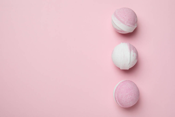 Bath balls on pink background, space for text - Photo, Image