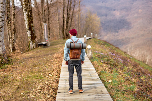 Rear view on Man hiker exploring mountains, Travel healthy lifestyle adventure trip - Zdjęcie, obraz