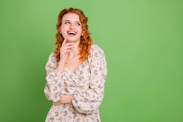 Photo of cheerful young happy attractive woman look empty space wonder isolated on green color background - Zdjęcie, obraz