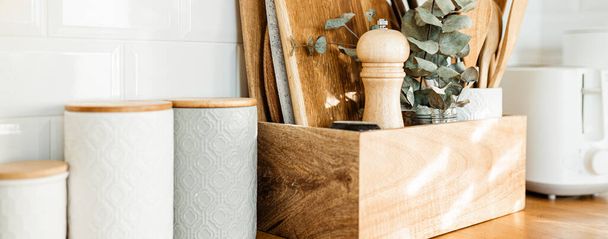 kitchen details, accessories, ceramic jars, wooden table - Foto, afbeelding