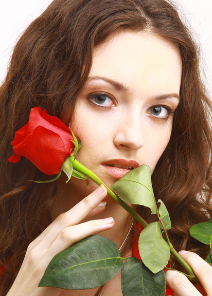 Studio portrait of sensual beautiful woman with rose - Foto, imagen
