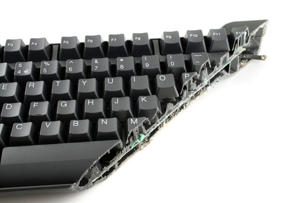 Modern keyboard cut completely in half showing keys and wires still in place - Photo, Image