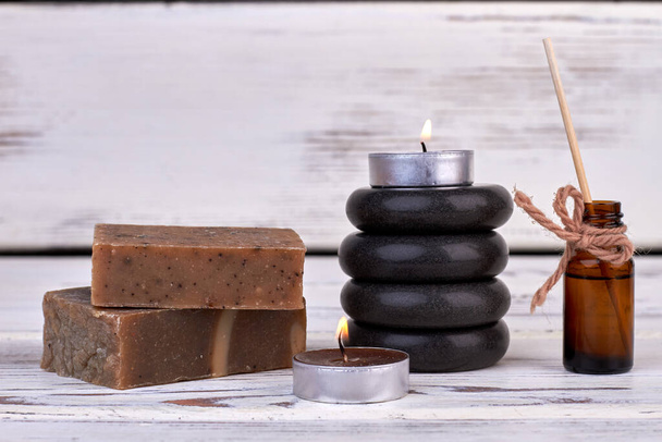 Soap bars with candles and stones for spa therapy. - Photo, Image
