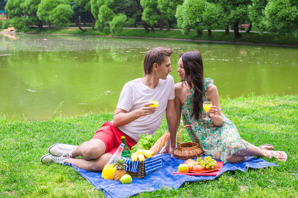 Young couple in love on a picnic outdoors - Foto, Bild