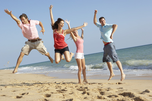 Group Of Friends Enjoying Beach Holiday - Foto, Imagem