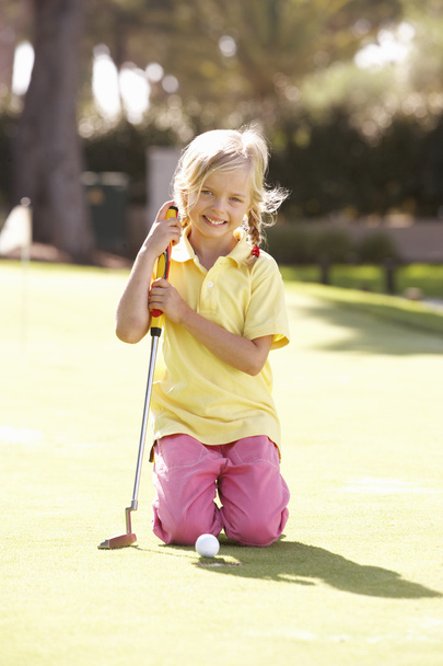 Young Girl Practising Golf On Putting On Green - Фото, изображение