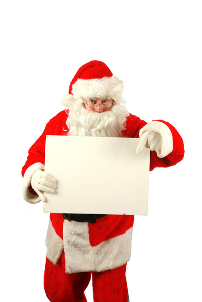 Christmas. Santa Claus. Santa Claus holds a Blank White Sign. Isolated on white. Room for text. Clipping Path. Santa Claus holds a Blank White Sign. Santa Isolated on white with a Blank Sign. Room for your text or image. Merry Christmas. Merry Xmas.  - Zdjęcie, obraz