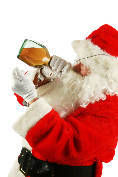Christmas. Santa Claus. Drunken Santa Claus. passed out drunken Santa Claus. Santa Booking Photo. Bad Santa. Santa Claus has been a Bad Bad Boy. Some lady left him a bottle of Brandy and he drank the whole bottle at once. Santa Claus is Under Arrest. - Photo, Image