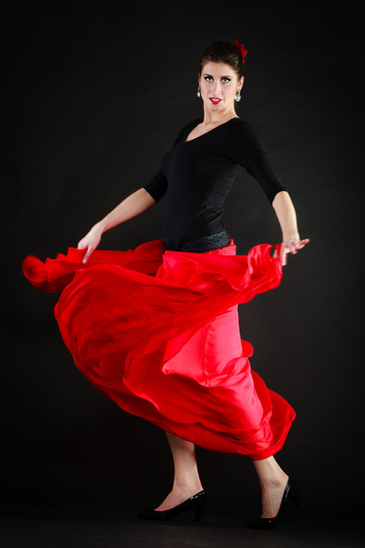 Dance. Spanish girl in red skirt dancing flamenco - Fotografie, Obrázek