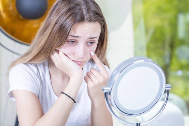 young beautiful woman applying makeup in bathroom - Photo, image