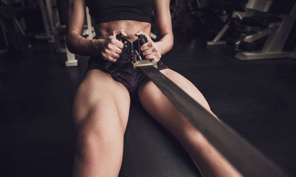 young woman with dumbbells in the gym - Fotografie, Obrázek