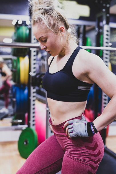 young woman with dumbbells in gym - Photo, Image