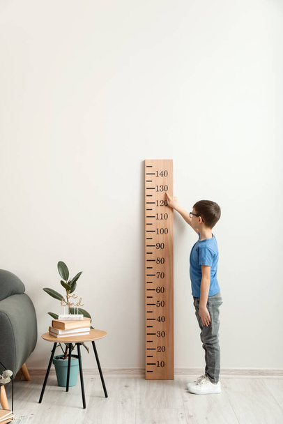 Little boy measuring height at home - Photo, Image
