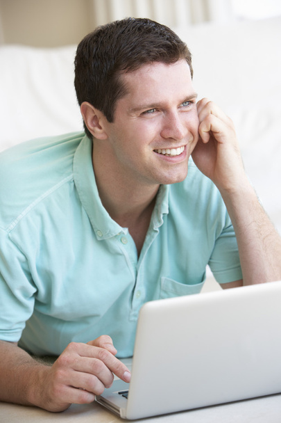 Young man on his laptop computer - Zdjęcie, obraz