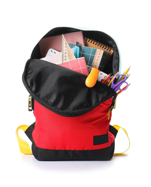 School backpack and stationery on white background - Photo, Image