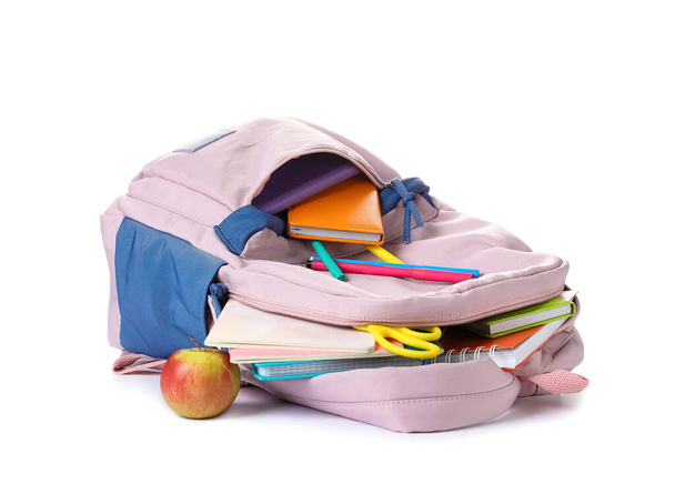 School backpack and stationery on white background - Fotó, kép