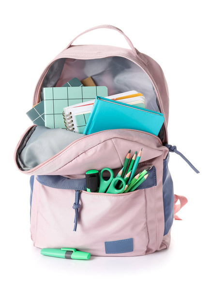 Шкільний рюкзак та канцелярські товари на білому тлі
 - Фото, зображення