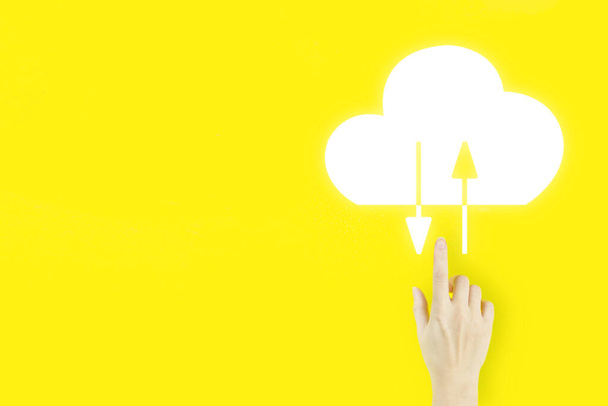 Abstract cloud connection technology background. Young woman's hand finger pointing with hologram Abstract cloud on yellow background. Cloud computing technology internet concept. - Photo, Image