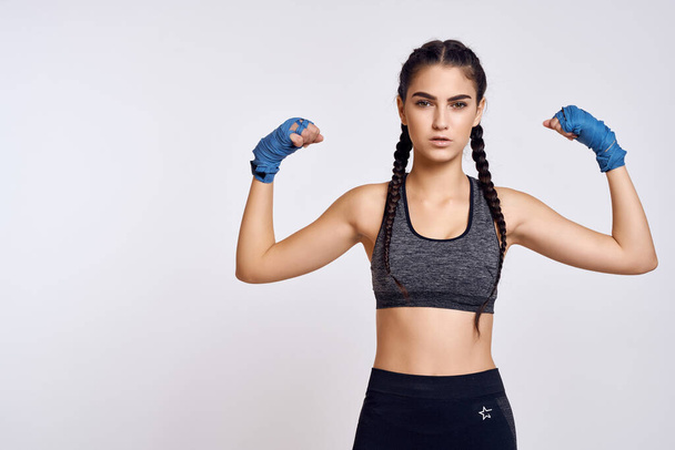athletic brunette in boxing bandages exercise fitness martial art - Valokuva, kuva