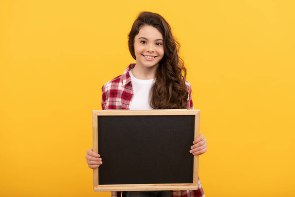 happy teen girl hold school blackboard for copy space, advertisement - Photo, Image