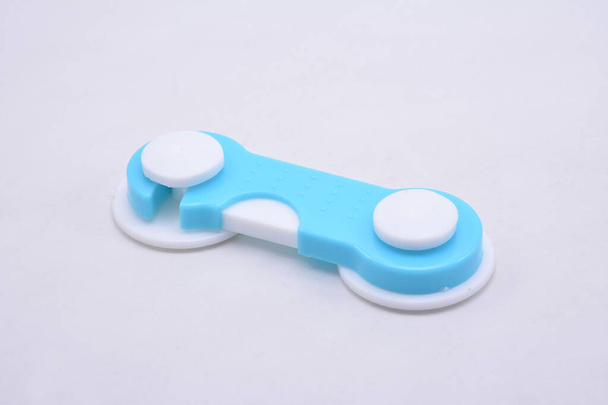 Plastic material swivel lock with adhesive at back use to put in side doors - Photo, Image