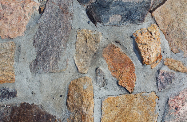 Colored stones on a grey background - Photo, Image