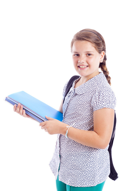 Portrait of a smiling school girl with backpack holding notebook - Zdjęcie, obraz